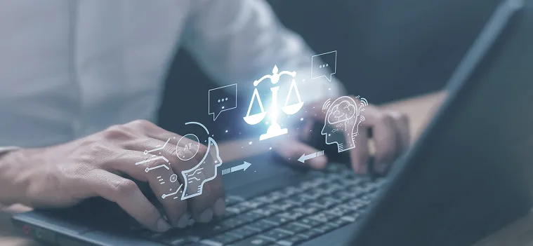 Man typing in his laptop